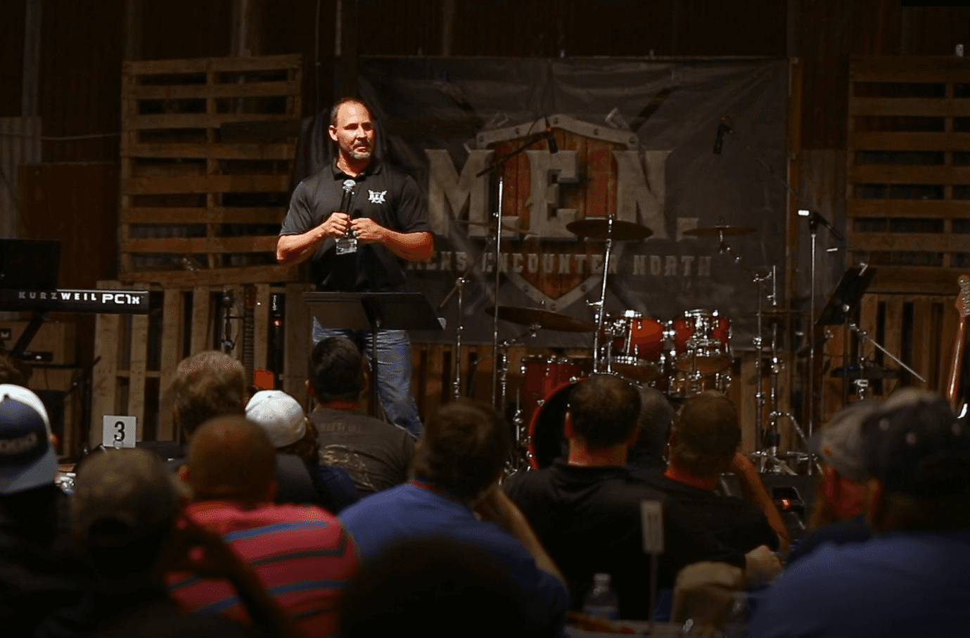 Bryan speaking at a men's conference